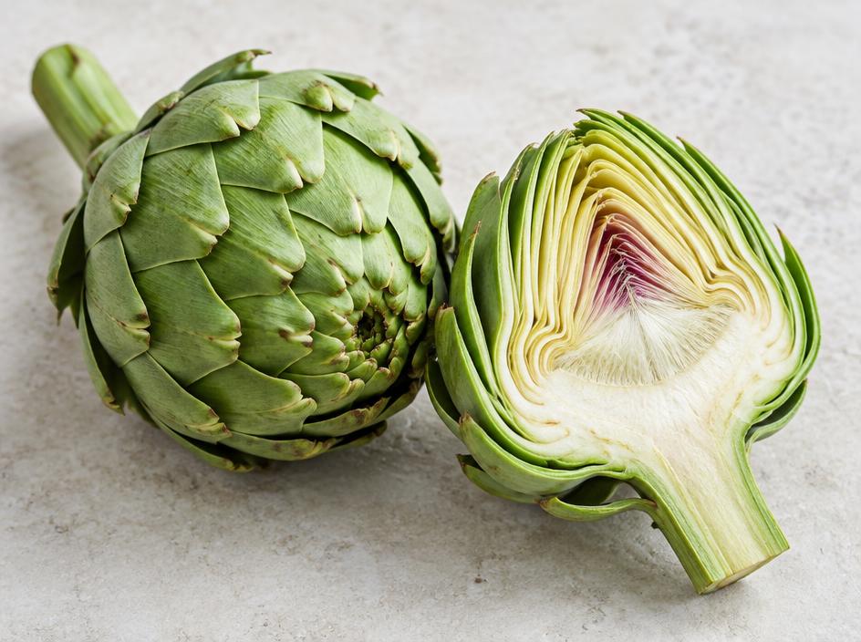 Fresh whole and halved artichoke